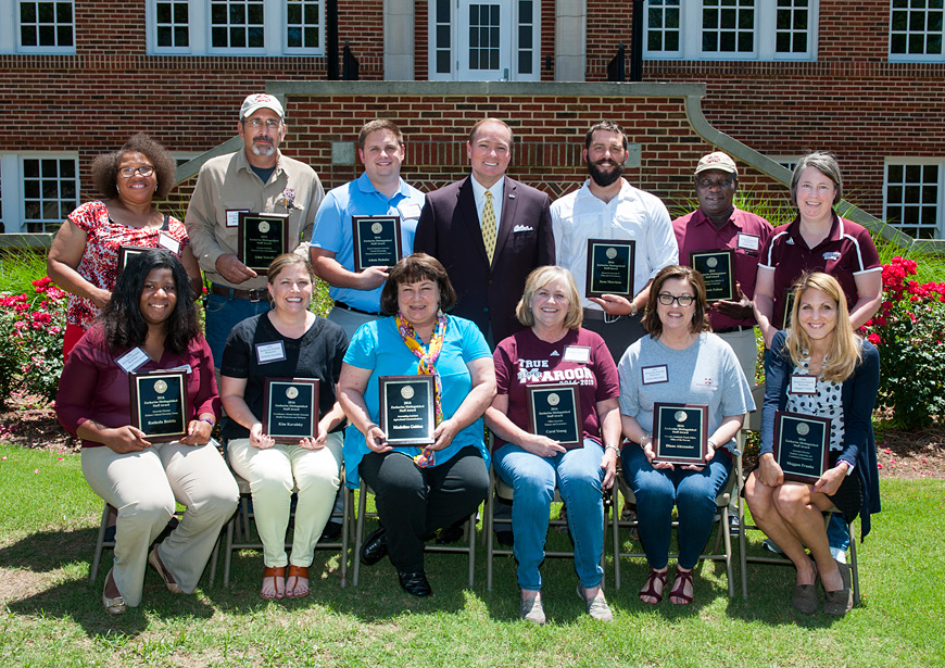 MSU President Mark E. Keenum (back, center) congratulates the university’s newest Zacharias Staff Award winners. They include (front, l-r), Ra’Sheda Forbes, Kim Kavalsky, Madeline Golden, Carol Young, Diane Alexander and Meggan Franks (back, l-r) Trudy Jones, John Vowell, Adam Rohnke, Jesse Morrison, Frank Fulton and Terri Snead. (Photo by Russ Houston)