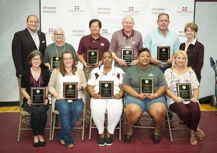 MSU President Mark E. Keenum (back, far left) and Tommie Zacharias, widow of former MSU President Donald Zacharias (back, far right), congratulate the university’s newest Zacharias Distinguished Staff Award winners. They include (front, l-r) Amy Adkerson, Ashley Meredith, Jennifer Robertson, Quintara Miller, Ericka Bazzill (back, l-r) Ann Ray, Scott Langlois, Tommy Parker and Cliff Covington. Not pictured are Carmen Wilder, Jeremy Hamilton and Ken Palmer. (Photo by Russ Houston)