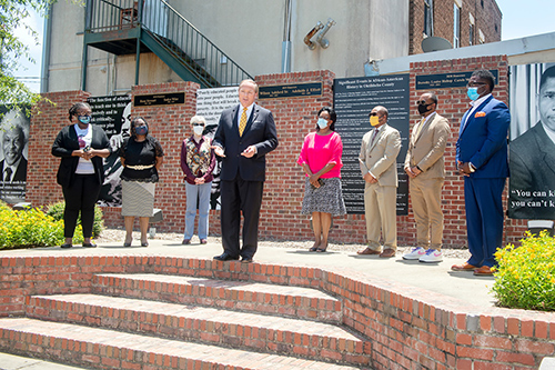 MSU President Mark E. Keenum speaks as several other leaders look on during an announcement at Unity Park.