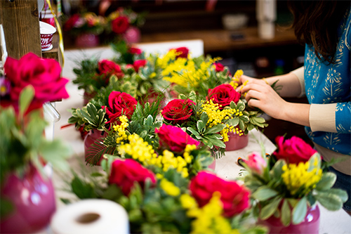 A student prepares arrangements at the University Florist