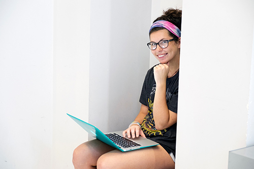 An MSU student studies on her laptop computer. 