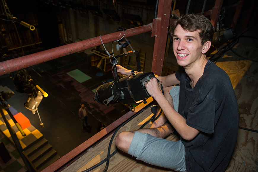 Mississippi State University freshman Spencer Floyd of Mooreville works on the lighting in the McComas Hall theater ahead of the Summer Scholars Onstage Camp presentation of “Primetime Pilots” on Friday and Saturday [July 22-23]. Admission to the musical is free and open to the public. (Photo by Sarah Dutton)    