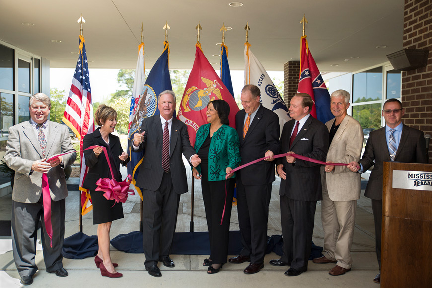 The Veterans Business Outreach Center in the Thad Cochran Research, Technology and Economic Development Park held a grand opening and ribbon cutting on Friday [Aug. 28]. The center helps veterans and their spouses either start a business or grow an existing business. From left are Bob Seitz, VBOC counselor; Sharon Oswald, dean of MSU’s College of Business; Mark Scott, VBOC director; Janita Stewart, director of the Small Business Administration’s Mississippi office; Trent Kelly, congressman for Mississippi’s 1st district; MSU President Mark E. Keenum; Rodney Pearson, MSU business professor and VBOC board member; and Mike Pornovets, head of the VBOC’s satellite office at The Innovation Center in Biloxi. (Photo by Mitch Phillips)