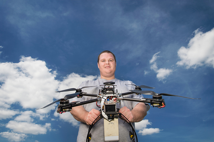 Conor Ferguson of Batesville holds a drone developed to optimize antenna placement for wireless internet service. During his time as an electrical engineering major at MSU, the December 2017 graduate reached out to other MSU students to form a team of electrical and computer engineers who have helped launch WISPr Systems. Ferguson and his associates utilized resources at the Center for Entrepreneurship and Outreach in MSU’s College of Business to work through the start-up process. This semester, the company received the largest Bulldog Angel Network investment to date. (Photo by Megan Bean)