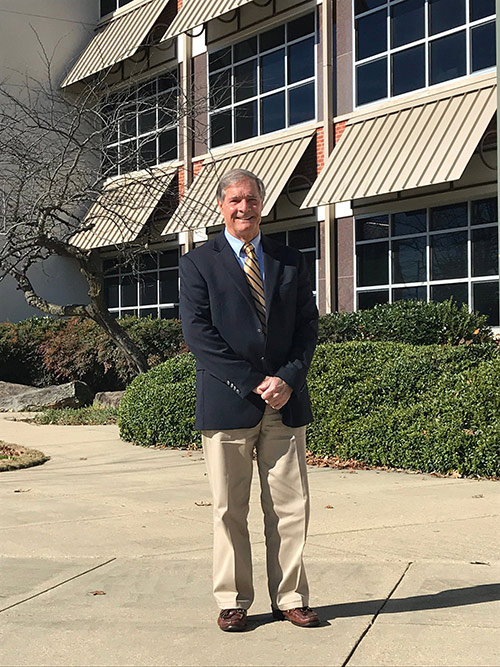 Charles Wax stands outside of Hilbun Hall, home of MSU's Department of Geosciences