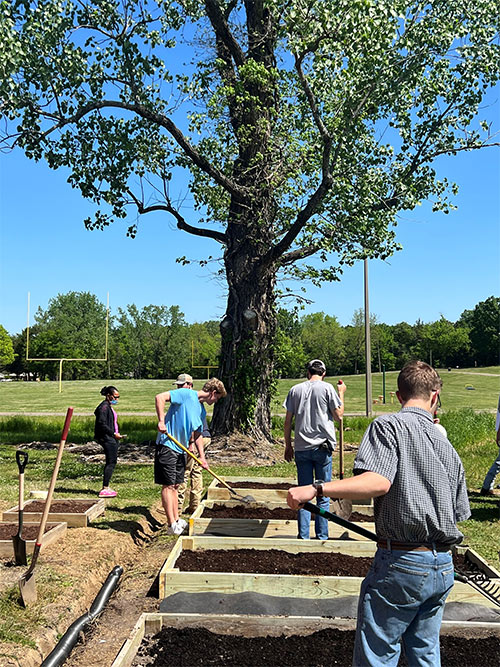 Students working to install planting beds 