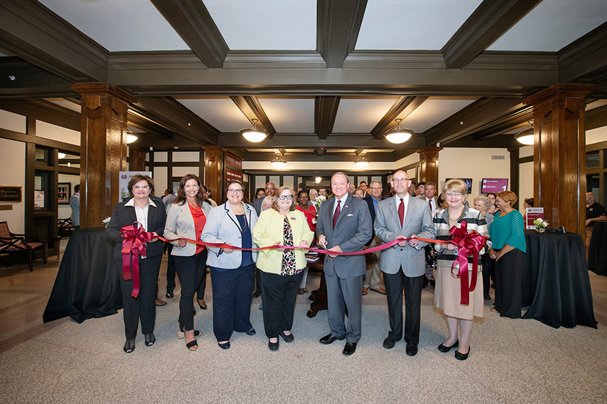 MSU officials celebrating the completed renovation of the university’s historic YMCA Building with a Tuesday [July 31] ribbon cutting were, from left, Vice President for Campus Services Amy Tuck; General Counsel Joan Lucas; Vice President for Student Affairs Regina Hyatt; Belinda Stewart of Belinda Stewart Architects; MSU President Mark E. Keenum; MSU Vice President for Finance and CFO Don Zant; and Provost and Executive Vice President Judy Bonner. (Photo by Megan Bean) 