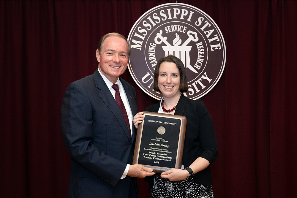 MSU President Mark E. Keenum congratulates Danielle Young, an instructor in the Department of Mathematics and Statistics, for receiving this year’s Zacharias Early Career Undergraduate Teaching Excellence Award. 