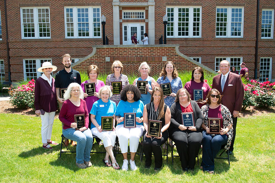 Tommie Zacharias, widow of former MSU President Donald Zacharias (back, far left), and MSU President Mark E. Keenum (back, far right) congratulate the university’s newest Zacharias Distinguished Staff Award winners. Recognized Friday [May 11] during the university’s annual Staff Appreciation Day, honorees include (front, l-r) Ardra Morgan, Suzanne Parker, Tiffney Williams, Elizabeth Miller, Joni Branning and Karrie Files; (back, l-r) John Michael VanHorn, Beth Hathcock, Teresa Stewart, Deborah Brewington, Katie Corban and Dana Cooper. (Photo by Megan Bean)