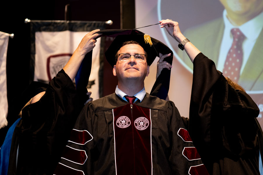 doctoral candidate getting his hood