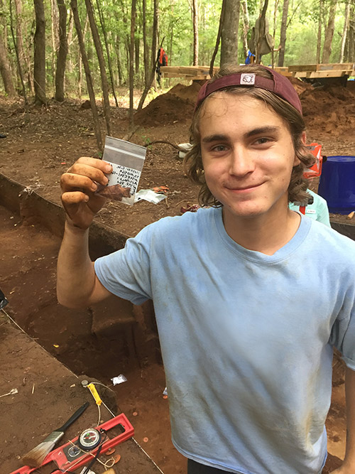 MSU senior anthropology major Cody Oscarson of Olive Branch displays a spear point from the early Holocene Epoch. The university is helping sponsor a statewide series of events in October in observation of Archaeology Month. (Photo submitted)