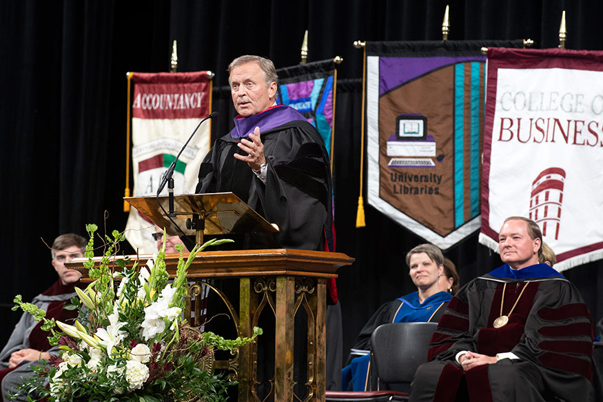 MSU accounting alumnus and best-selling author John Grisham speaks to new MSU students Tuesday [Aug. 28] during Fall Convocation at Humphrey Coliseum. (Photo by Beth Wynn)