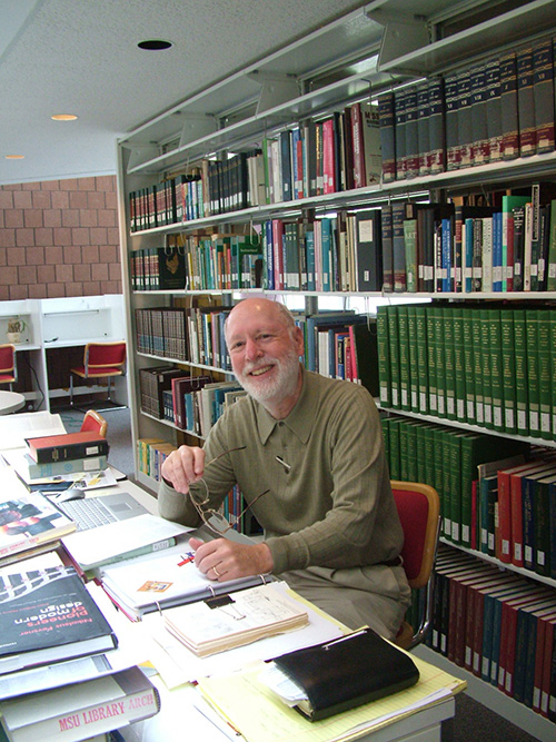 Michael Fazio, pictured in the library in Giles Hall