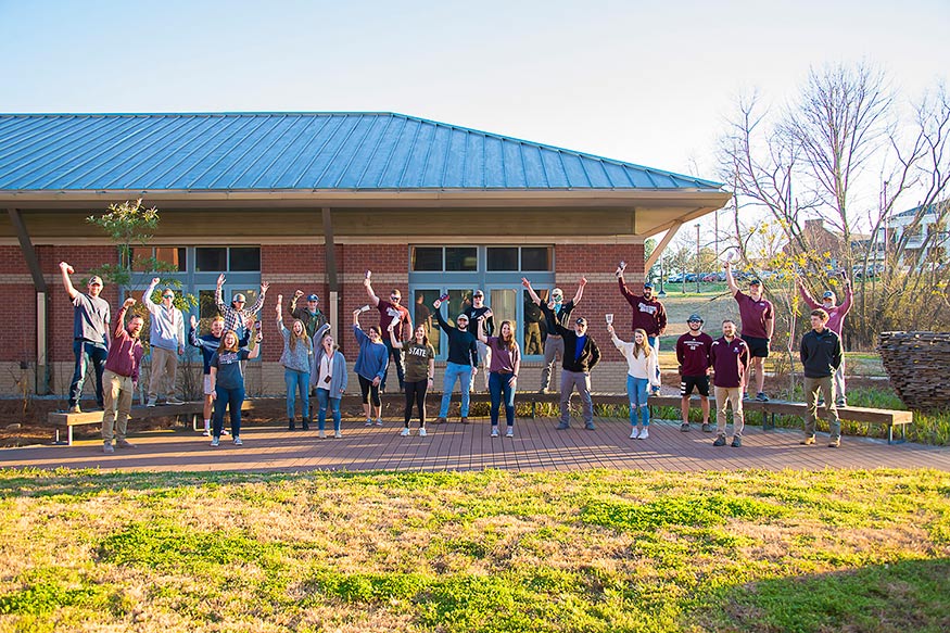 A group of students and faculty advisors of the MSU Student Chapter of the National Association of Landscape Professionals are pictured outside of the Landscape Architecture Facility
