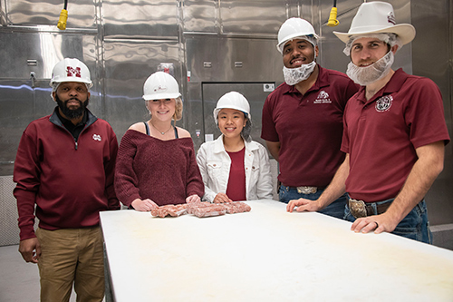 Associate Professor Derris Devost-Burnett with students Chelsie Dahlgren, Virell To, Maliq Holmes and Joseph Mangano in MSU’s Meat Science and Muscle Biology Laboratory. 