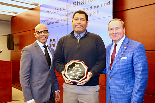 Trustee Dr. Steven Cunningham, left, and MSU President Mark E. Keenum, right, congratulate Donald Shaffer, associate professor in MSU’s Department of English and director of the university’s African American Studies program, who received a 2020 Diversity Award during IHL’s annual Diversity Awards program Feb. 20.