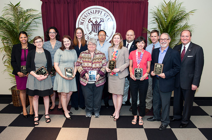 Graduates of the 2015-2016 Fred Tom Mitchell Faculty Leadership Program were recognized during Mississippi State's annual research awards banquet Thursday [April 28], and congratulated by MSU President Mark E. Keenum (right). They are (l-r) Lakieshia Williams, Bonnie O’Neill, Amanda Clay Powers, Janet Donaldson, Kimberly Hall, Deborah Lee, Shien Lu, Kathleen Sherman-Morris, Dean Jousan, Lisa Wallace, Jack Smith and Joe Wilmoth. (Photo by Russ Houston)