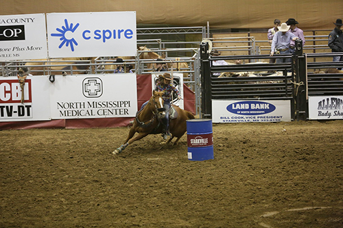 A contestant participates in the barrel race during the Mississippi Horse Park's 2019 Rotary Classic Rodeo.