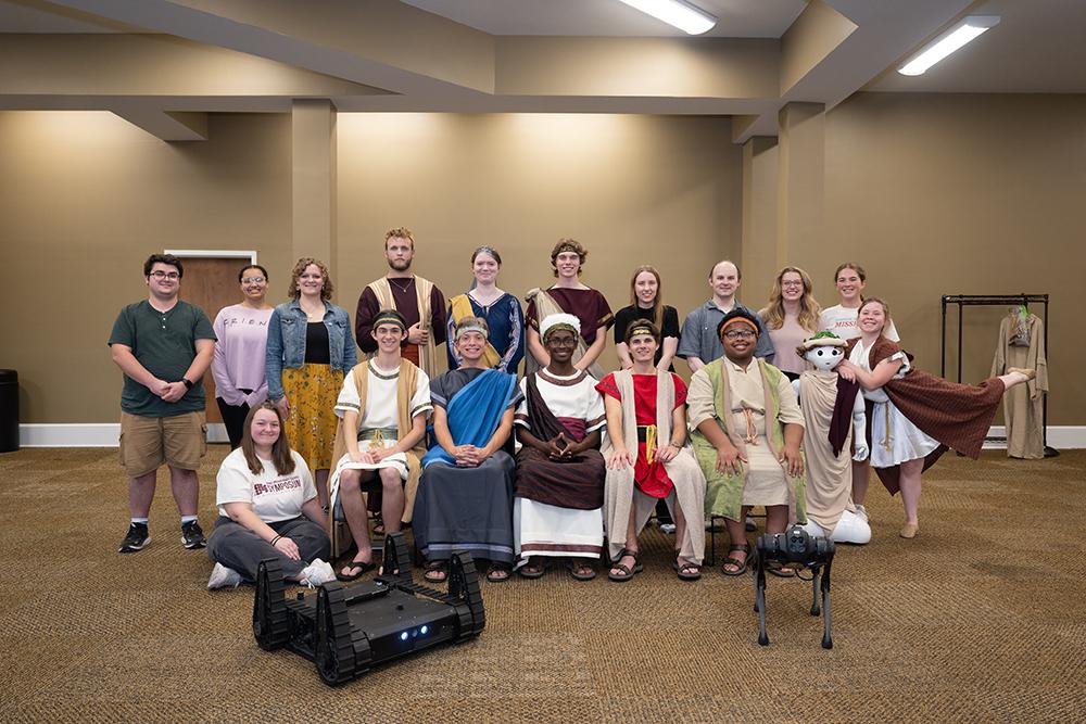 Honors students pose during play practice.