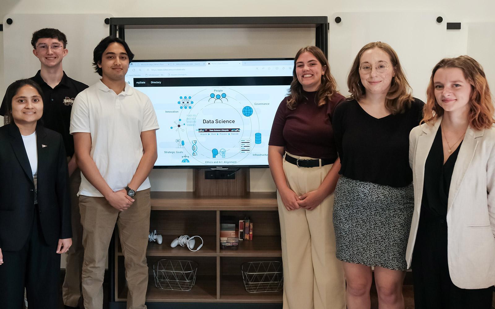 Mississippi State data science students’ research solves real-world problems through artificial intelligence. From left, Samata Luintel, Joshua King, Soyab Karki, Olivia Goodman, Riley Tuccio and Penelope Prochnow. (Photo by Sarah Kirk)