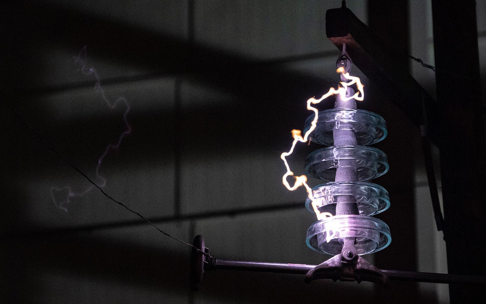 A bolt of electricity makes its way through equipment in MSU's Paul B. Jacobs High Voltage Laboratory. As the largest lab of its kind among North American universities, it serves as a university research center for high voltage engineering. To help electrical companies during disasters, MSU recreates a variety of real-world scenarios inside the lab—falling trees, thunderstorms, solar radiation, high salt concentrations and more. (OPA photo)