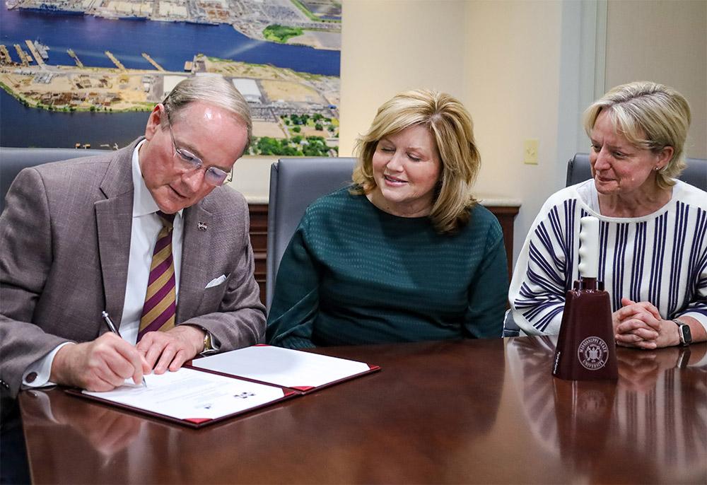 MSU President Mark E. Keenum, Huntington Ingalls Vice President of Human Resources and Administration Susan Jacobs, and Huntington Ingalls Executive Vice President and Ingalls Shipbuilding President Kari Wilkinson are pictured during a Memorandum of Understanding signing Wednesday [Oct. 23].