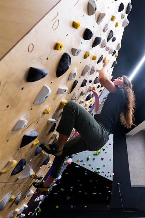 Tori Welch, a senior natural resources and environmental conservation major from Miramar, Florida, climbs in the new bouldering cave at MSU’s newly renovated Joe Frank Sanderson Center. Welch is a student worker in the Outdoor Adventures area.