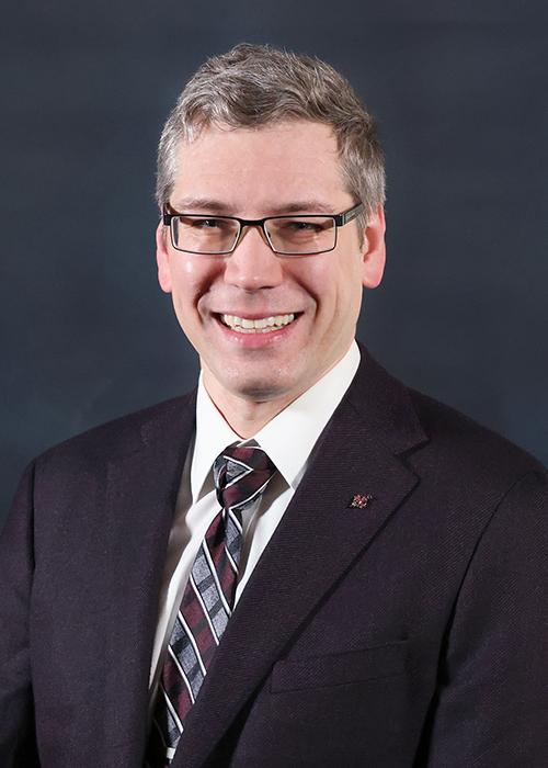 A portrait of Craig Merrett.