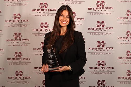 Serena Rozsa poses with an award.