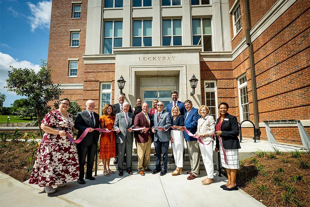 Luckyday Foundation members of the board of managers celebrate Friday [Aug. 8] during Azalea Hall’s ribbon cutting.