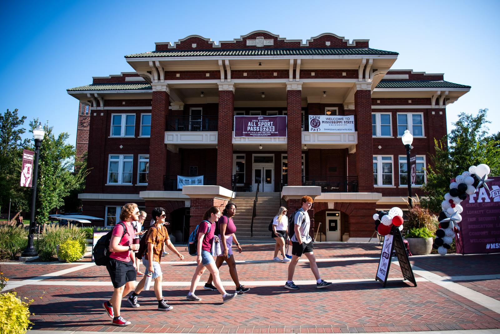 Students walking in front of a building