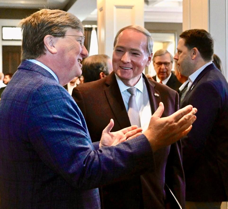 Gov. Tate Reeves and MSU President Mark E. Keenum talk Aug. 19 at the groundbreaking of the Mississippi Cyber and Technology Center in Biloxi.