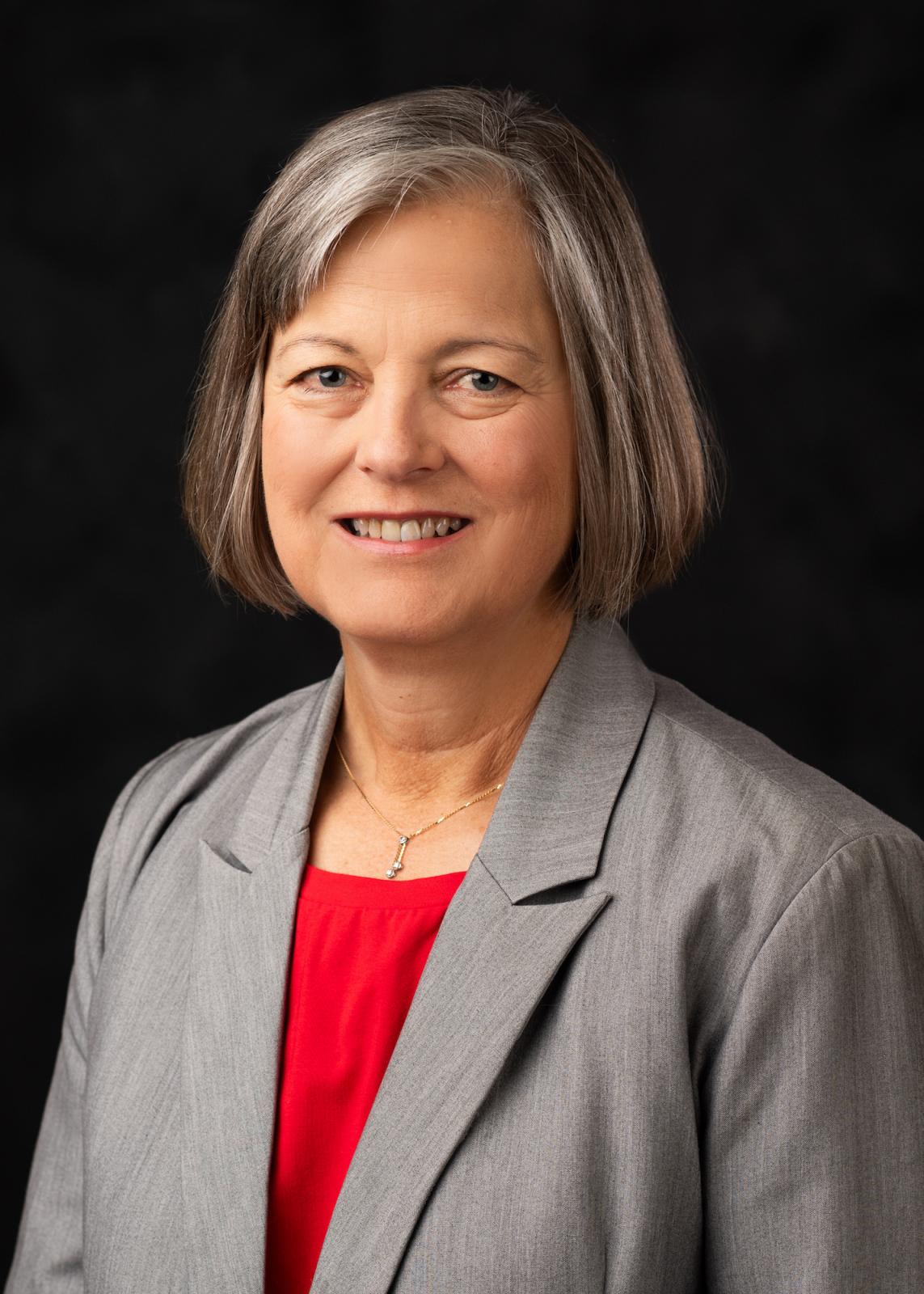 Woman in grey blazer