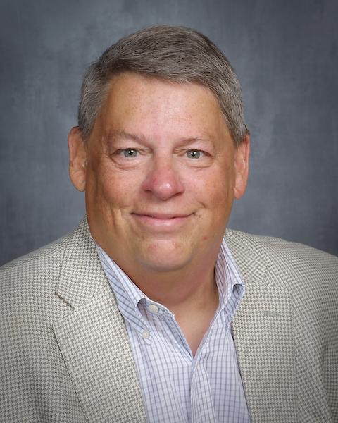 Man in beige suit