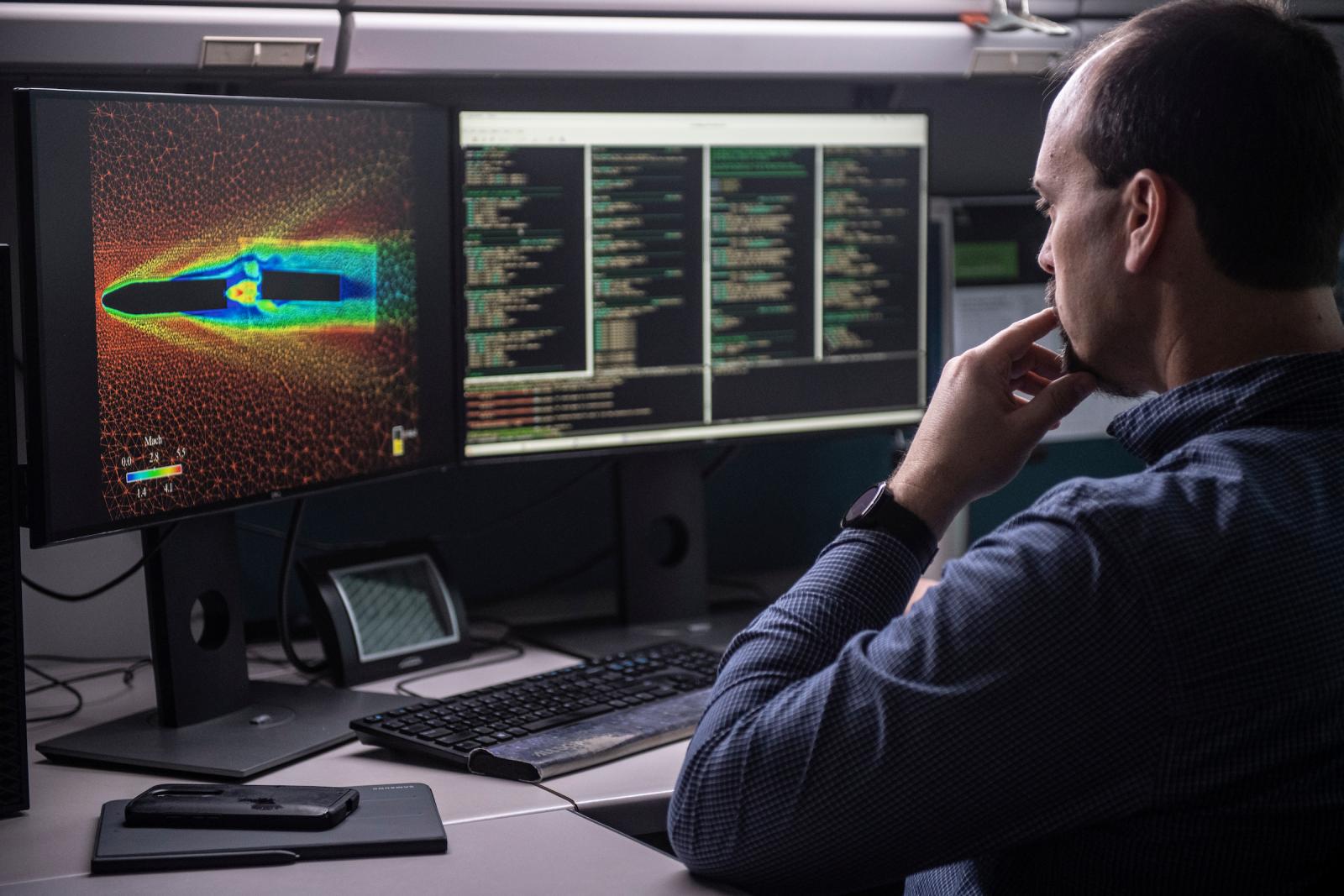 man looking at computer