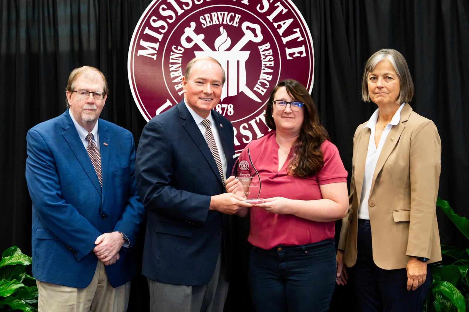Vice President for DAFVM Keith Coble, MSU President Mark E. Keenum, Assistant Professor Melanie Boudreau, and Vice President for Research and Economic Development Julie Jordan
