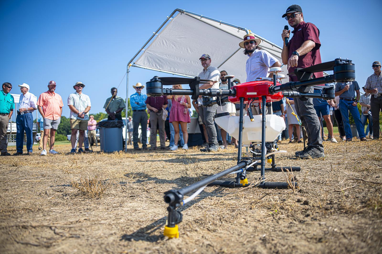 MSU researchers demonstrate unmanned aircraft systems with spray capabilities during a recent agronomy field day.