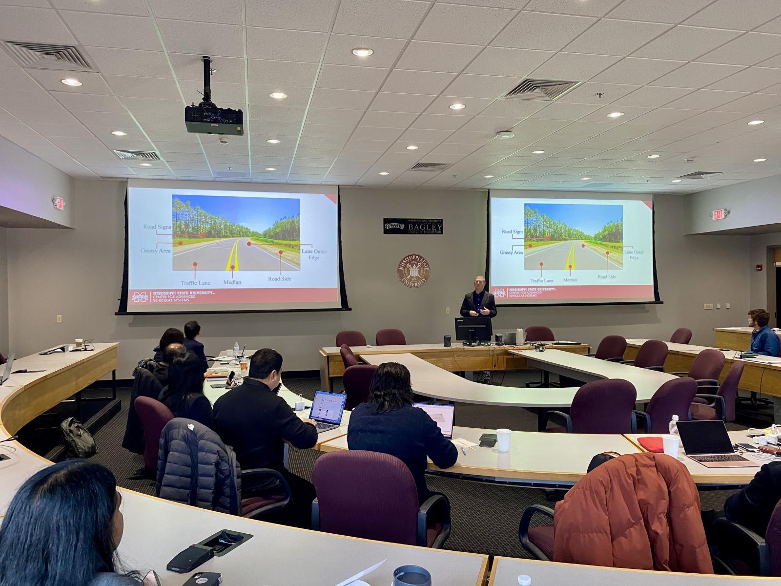 MSU Center for Advanced Vehicular Systems Associate Director Daniel Carruth gives a presentation during the 7th International Symposium on Advanced Vehicle Technology.