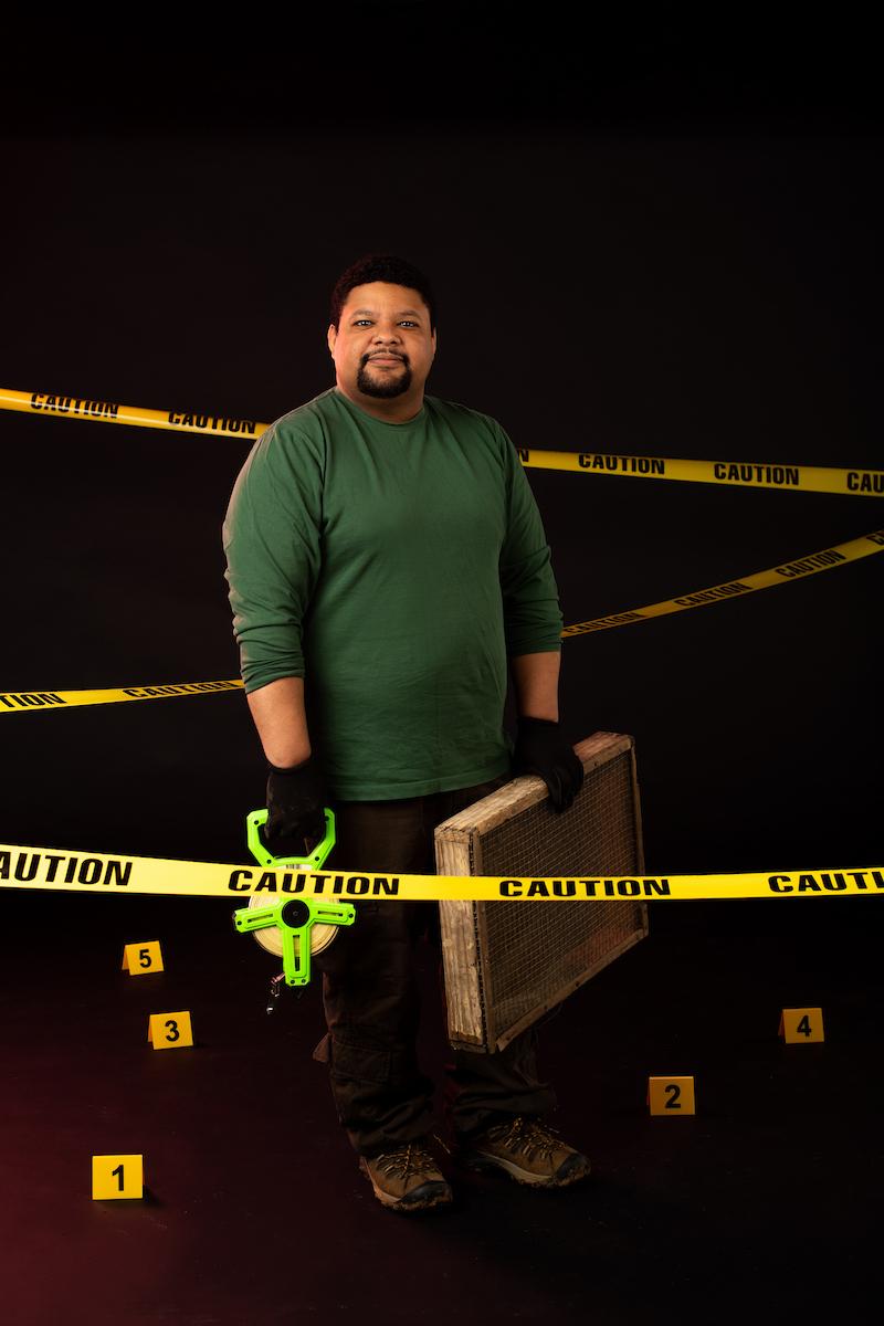 man behind police tape