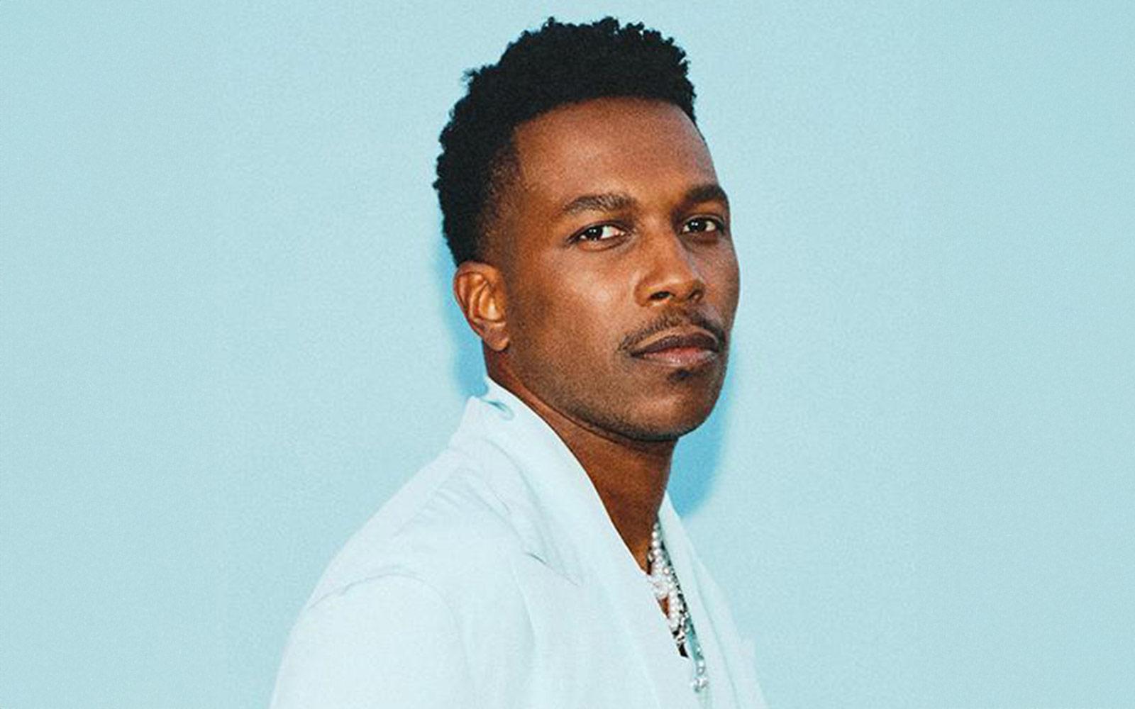 man in blue suit on blue background