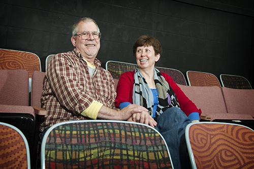 A portrait of Wayne “Dur” and Betty “Jo” Durst sitting in theater seats.
