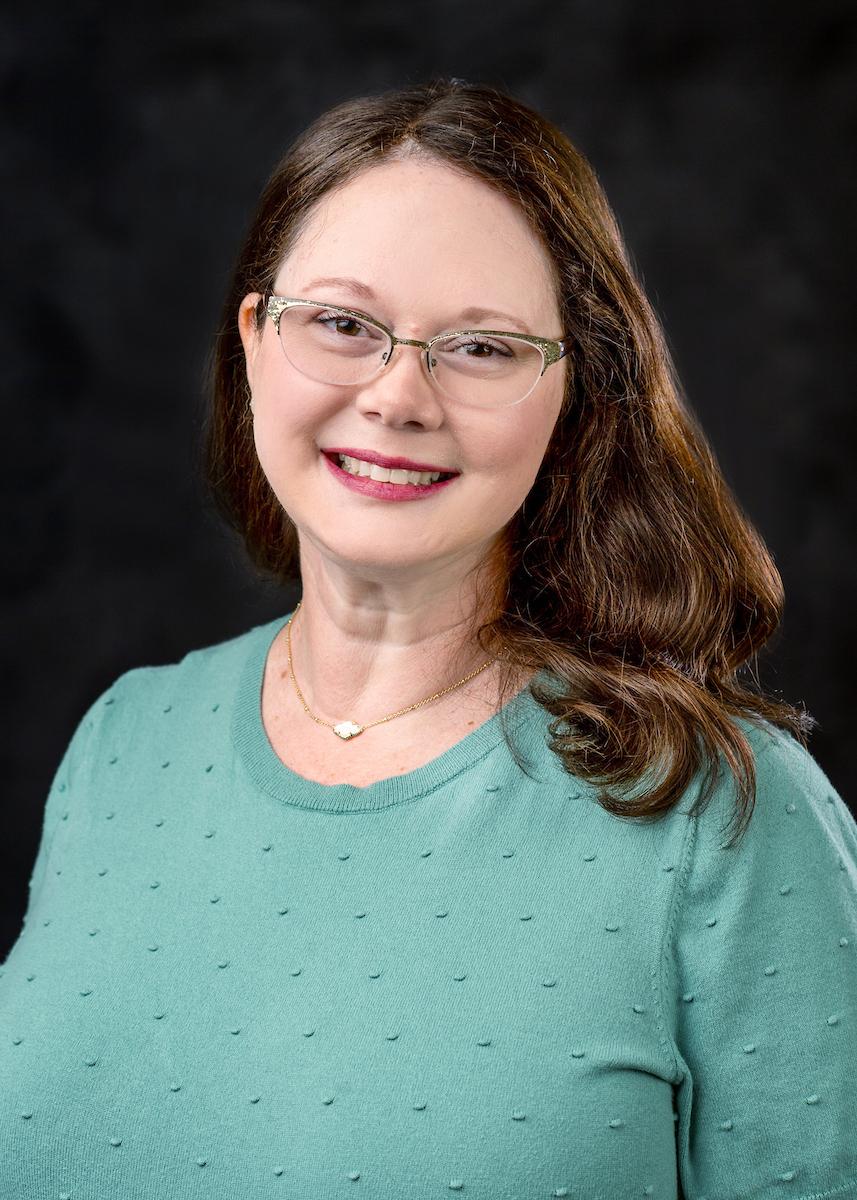 woman in teal sweater