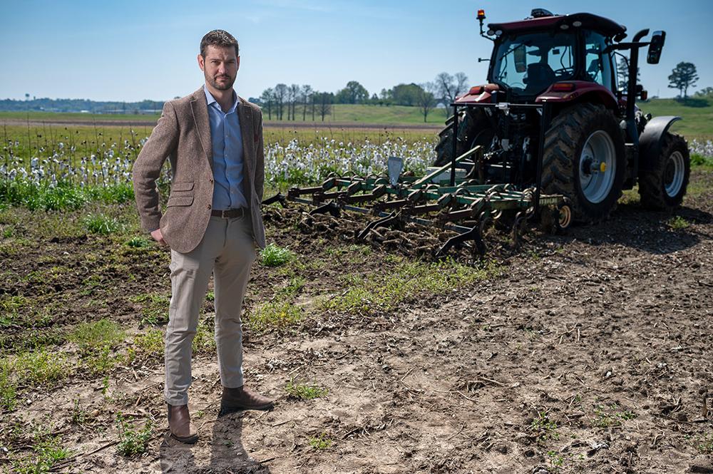 Kit Franklin, a visiting scholar at Mississippi State University's Agricultural Autonomy Institute, poses at the institute's North Farm proving ground. (Photo by Kevin Hudson)