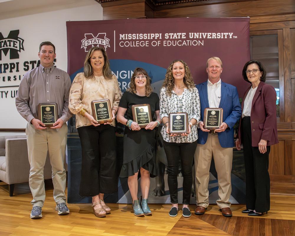 MSU PHOTO ID: From left: Kyle Baggerly, Betty Purvis Staff Award; Michelle Stubbs, Donnie Prisock Excellence in Access and Engagement Award; Stephanie Lemley, Herb Handley Research Award; Beca Spencer, Cindy Rose Teaching Award; Mark Wildmon, Clyde Muse Service Award; and Mississippi State College of Education Dean Teresa Jayroe.