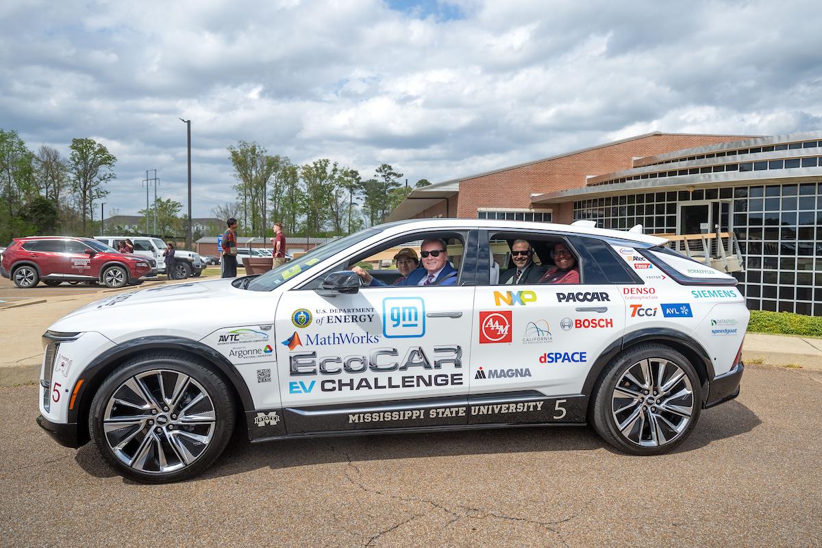 President Keenum in car with MSU officials