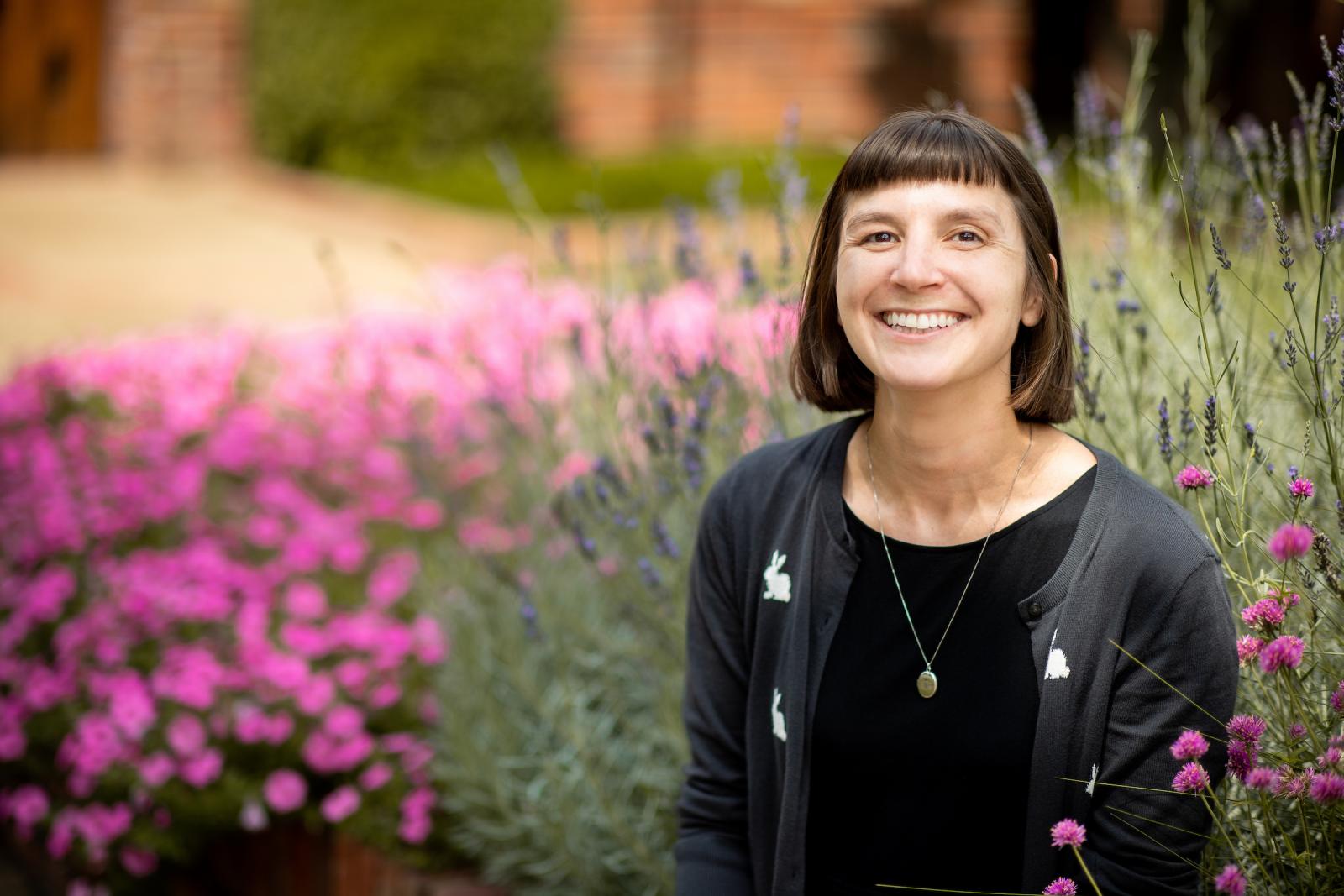 photo of Mary E. Dozier in front of pink flowers