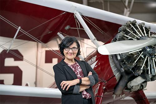 Rani Sullivan (Professor, Head, and Endowed Chair of the Department of Aerospace Engineering) with Raspet's Stearman airplane.