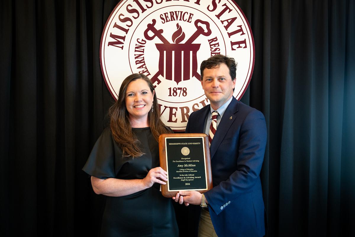 MSU Interim Associate Vice President for Strategic Partnerships Tabor Mullen, left, presents the Irvin Atly Jefcoat Excellence in Advising Award to staff recipient Amy McMinn.