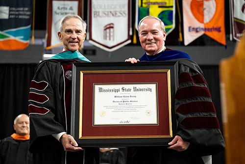 From left, retired ConocoPhillips executive William “Bill” Berry receives an honorary Doctor of Public Service degree Friday [May 15] from Mississippi State President Mark E. Keenum.
