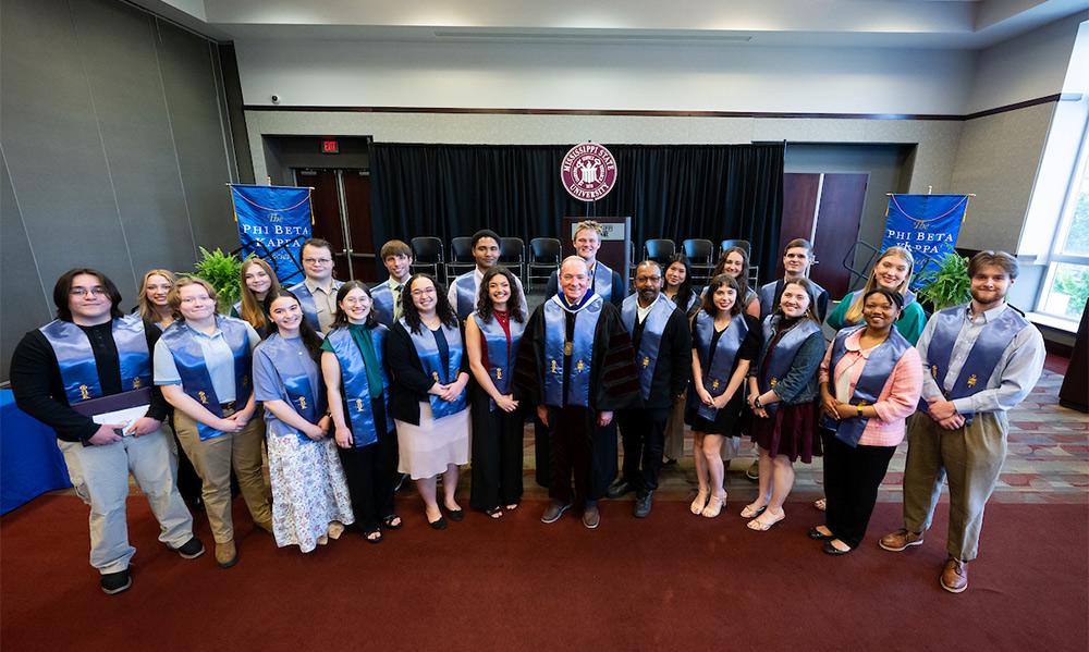 Mississippi State seniors and 2026 inductees into Phi Beta Kappa’s Gamma of Mississippi Chapter are pictured with MSU President Mark E. Keenum, center, and Professor Anthony Neal, an MSU Judy and Bobby Shackouls Honors College faculty fellow and member of the Department of Philosophy and Religion, who also was inducted into PBK as an honorary member.